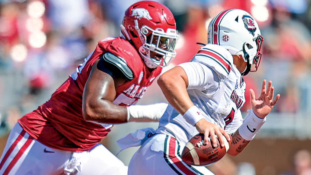 Arkansas defensive lineman Eric Gregory runs down Spencer Rattler in the 2022 SEC season opener.